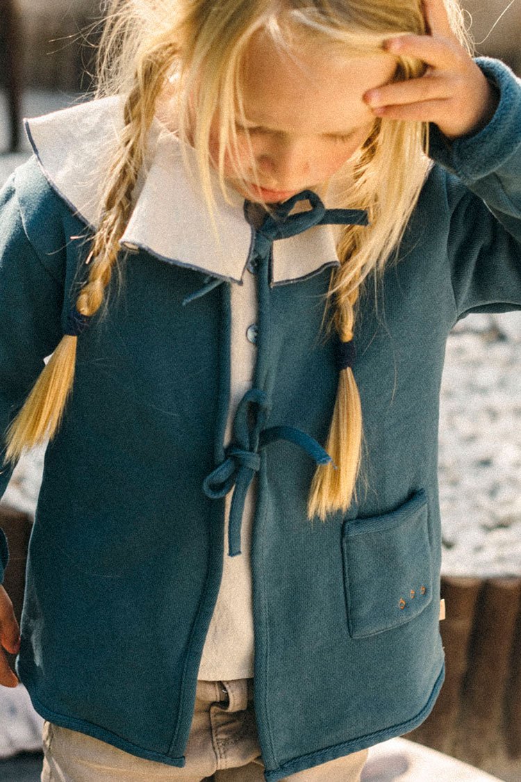 Blue jacket with bows